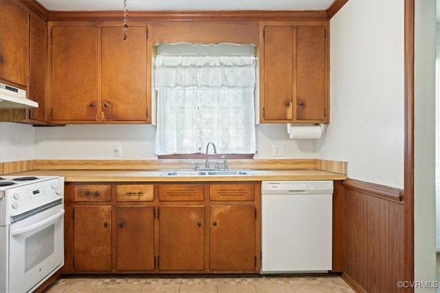 43 Franktown Rd, Hampton, VA 23663 - kitchen with white appliances, light countertops, under cabinet range hood, wainscoting, and brown cabinetry