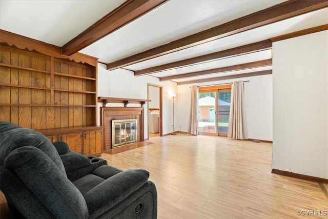 43 Franktown Rd, Hampton, VA 23663 - living room featuring light wood finished floors, a fireplace with flush hearth, and beamed ceiling