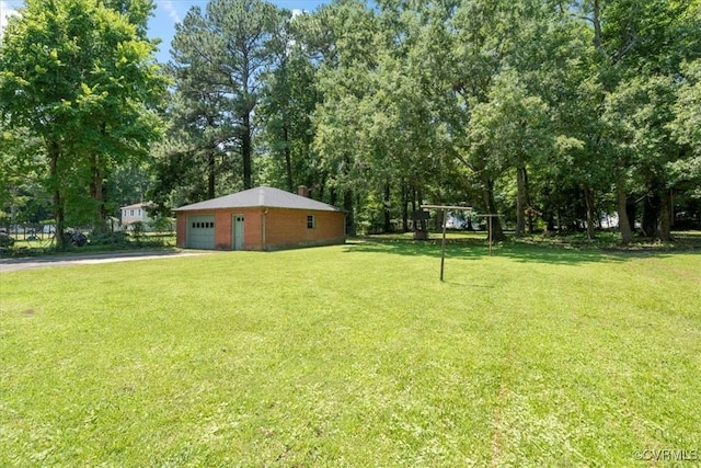 43 Franktown Rd, Hampton, VA 23663 - view of grassy yard featuring driveway, view of scattered trees, and an outbuilding