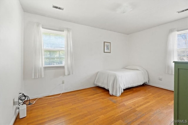 43 Franktown Rd, Hampton, VA 23663 - bedroom with multiple windows and light wood-type flooring