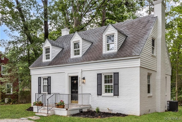 1217 Forest Ave, Henrico, VA 23229 - cape cod home with a chimney, brick siding, and a front yard