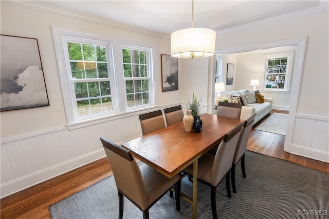 1217 Forest Ave, Henrico, VA 23229 - dining room with wood finished floors, healthy amount of natural light, crown molding, and a wainscoted wall