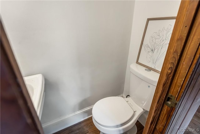 1217 Forest Ave, Henrico, VA 23229 - bathroom featuring toilet and wood finished floors