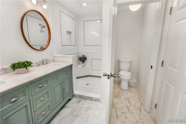 1217 Forest Ave, Henrico, VA 23229 - full bathroom featuring double vanity, a tile shower, marble finish flooring, and recessed lighting