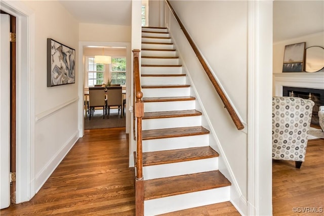 1217 Forest Ave, Henrico, VA 23229 - stairs featuring wood finished floors and a fireplace