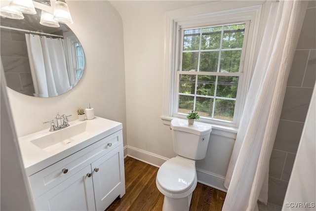 1217 Forest Ave, Henrico, VA 23229 - bathroom with wood finished floors, vanity, healthy amount of natural light, and a shower with shower curtain