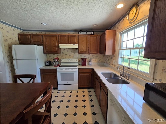 4104 Farm Creek Ter, Henrico, VA 23223 - kitchen with white appliances, under cabinet range hood, a textured ceiling, light countertops, and light flooring