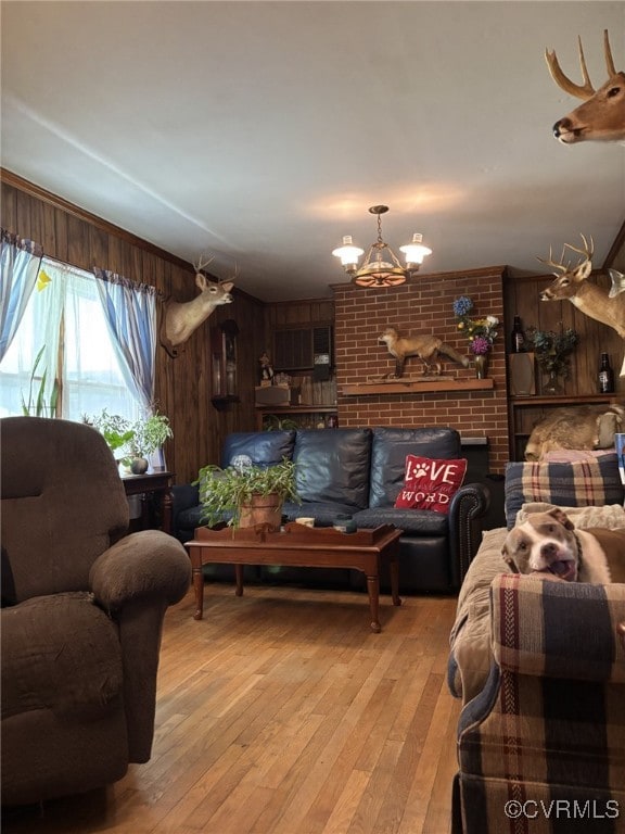 3246 Tabscott Rd, Goochland, VA 23038 - living room with a chandelier, light wood finished floors, and wooden walls