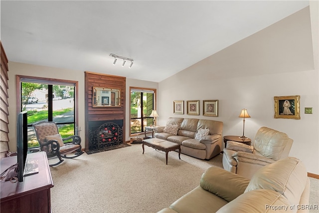 10000 Silverleaf Ter, Chesterfield, VA 23236 - living area featuring carpet, a fireplace with flush hearth, track lighting, and vaulted ceiling
