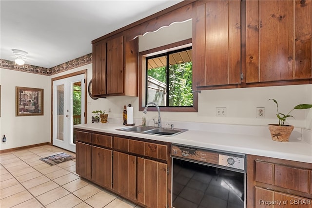 10000 Silverleaf Ter, Chesterfield, VA 23236 - kitchen featuring dishwasher, light tile patterned floors, healthy amount of natural light, and light countertops