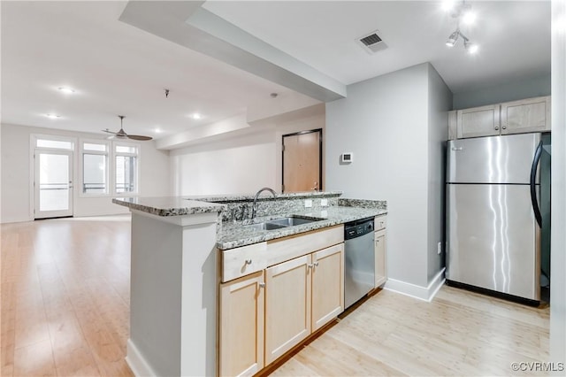 110 W Marshall St Unit U25, Richmond, VA 23220 - kitchen with appliances with stainless steel finishes, light wood-style flooring, light stone countertops, and recessed lighting