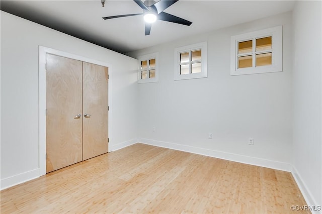 110 W Marshall St Unit U25, Richmond, VA 23220 - unfurnished bedroom featuring light wood-style flooring, ceiling fan, and a closet