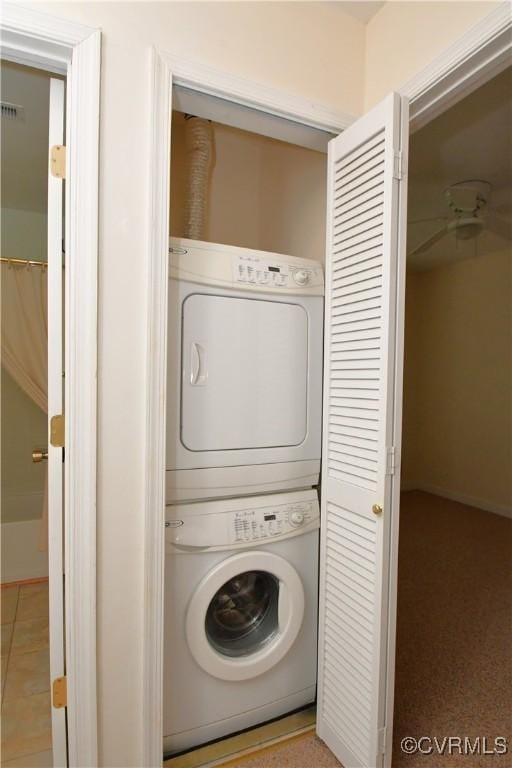 10106 Redbridge Rd, North Chesterfield, VA 23236 - laundry room featuring stacked washer / drying machine and baseboards