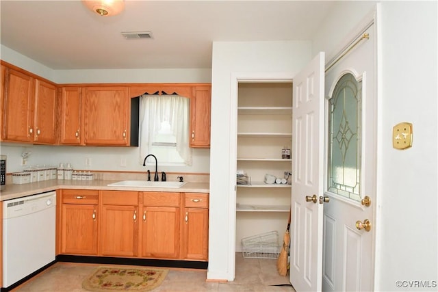 10106 Redbridge Rd, North Chesterfield, VA 23236 - kitchen with dishwasher, light countertops, and brown cabinets