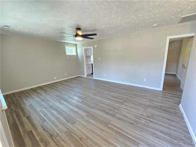 5102 Randall Ave, Henrico, VA 23231 - spare room featuring ceiling fan, wood finished floors, and a textured ceiling