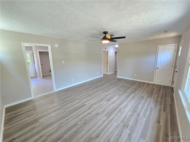 5102 Randall Ave, Henrico, VA 23231 - empty room featuring wood finished floors, a textured ceiling, and a ceiling fan