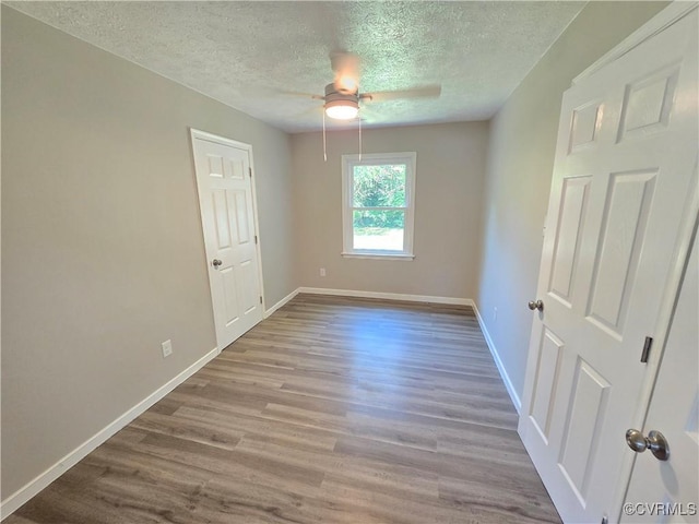 5102 Randall Ave, Henrico, VA 23231 - spare room featuring ceiling fan, a textured ceiling, and wood finished floors