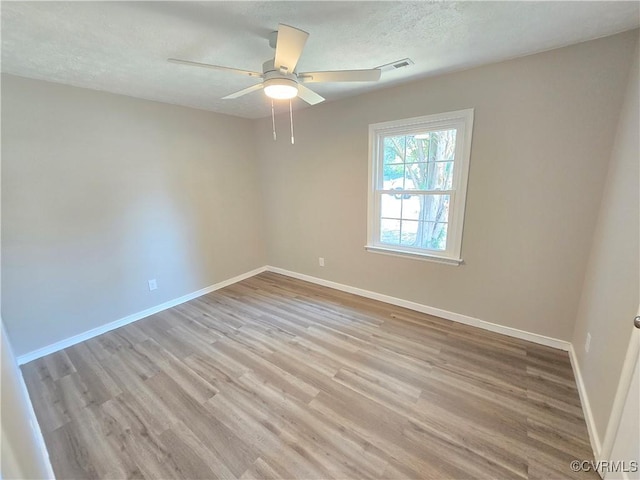 5102 Randall Ave, Henrico, VA 23231 - unfurnished room featuring a ceiling fan, light wood-style floors, and a textured ceiling