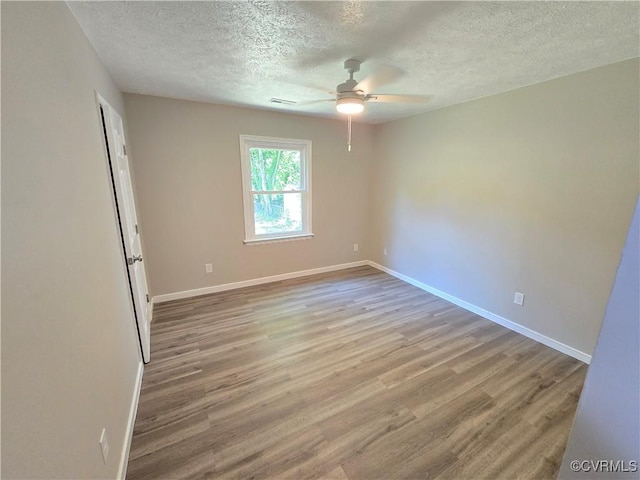 5102 Randall Ave, Henrico, VA 23231 - empty room featuring a textured ceiling, wood finished floors, and ceiling fan