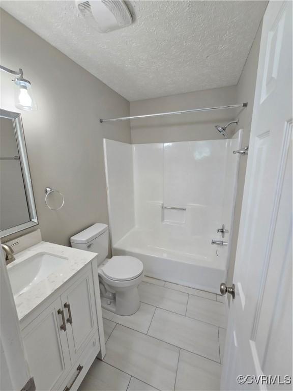 5102 Randall Ave, Henrico, VA 23231 - bathroom with vanity, bathtub / shower combination, a textured ceiling, and tile patterned flooring
