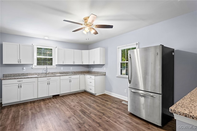 2803 Drewrys Bluff Rd, Chesterfield, VA 23237 - kitchen featuring freestanding refrigerator, ceiling fan, white cabinetry, and light stone counters