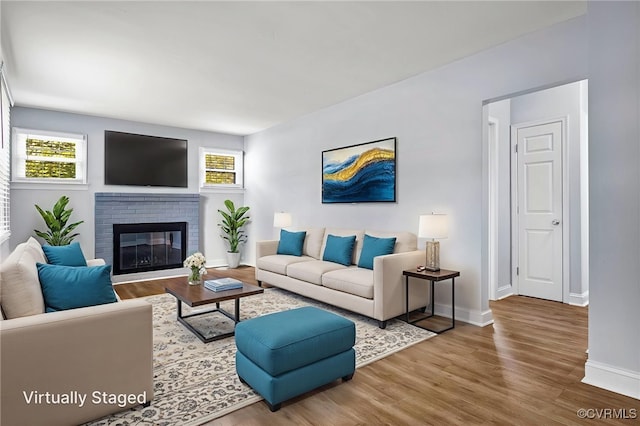 2803 Drewrys Bluff Rd, Chesterfield, VA 23237 - living room featuring wood finished floors and a brick fireplace