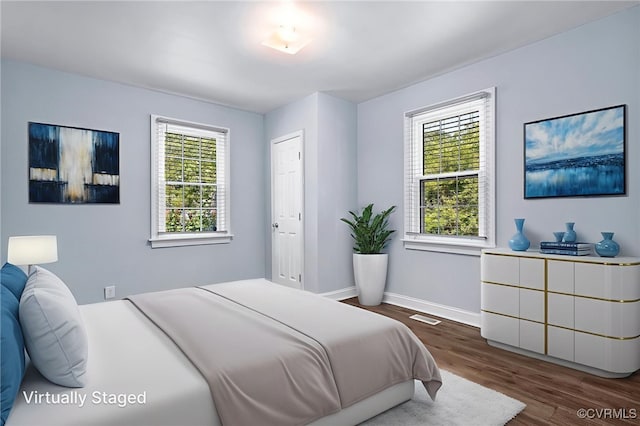2803 Drewrys Bluff Rd, Chesterfield, VA 23237 - bedroom with multiple windows and dark wood-type flooring