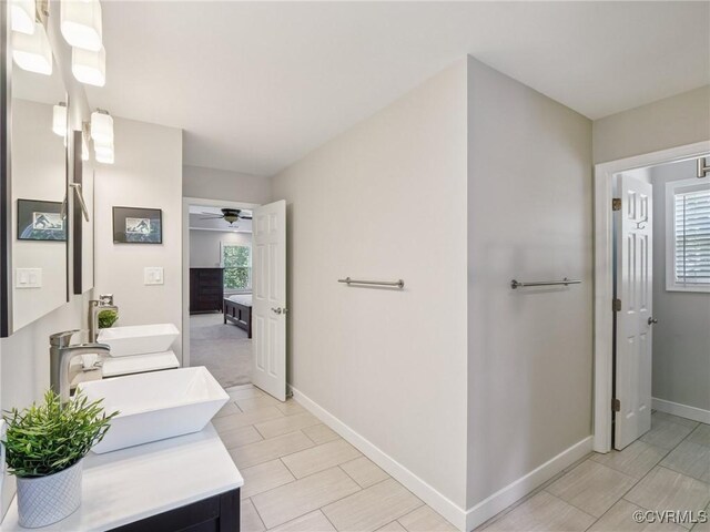 13625 Brandy Oaks Rd, Chesterfield, VA 23832 - bathroom with double vanity, ceiling fan, and healthy amount of natural light