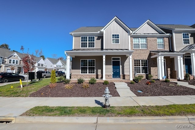 6401 Belay Dr, Chesterfield, VA 23234 - townhome / multi-family property with brick siding, board and batten siding, a porch, and a residential view