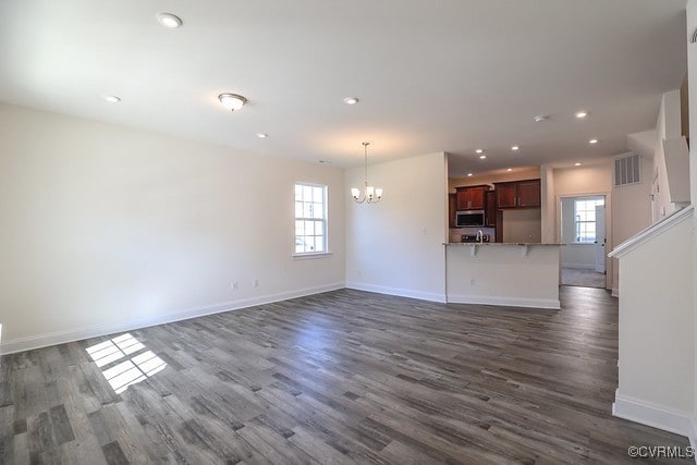 6401 Belay Dr, Chesterfield, VA 23234 - unfurnished living room with a chandelier, dark wood-style flooring, and recessed lighting