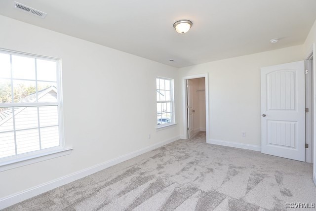 6401 Belay Dr, Chesterfield, VA 23234 - unfurnished bedroom with light colored carpet and a walk in closet