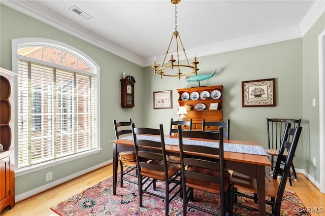 818 Krim Point Loop, Midlothian, VA 23114 - dining space with a chandelier, light wood-style floors, and ornamental molding
