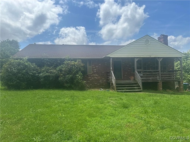 1290 Grapevine Rd, Henrico, VA 23150 - view of front of property with covered porch, a front lawn, brick siding, and a chimney