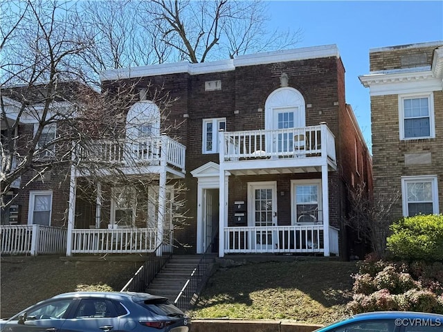 3009 Patterson Ave, Richmond, VA 23221 - view of property featuring covered porch, a balcony, and brick siding