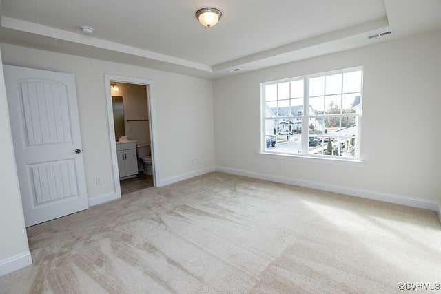 6407 Belay Dr, Chesterfield, VA 23234 - unfurnished bedroom featuring a raised ceiling, light colored carpet, and connected bathroom