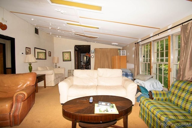 1026 Hoecake Rd, Lancaster, VA 22513 - carpeted living area with vaulted ceiling