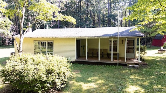 1026 Hoecake Rd, Lancaster, VA 22513 - rear view of house featuring a lawn and a chimney