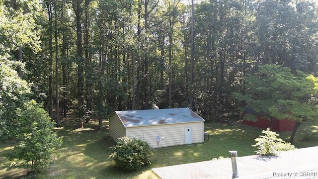 1026 Hoecake Rd, Lancaster, VA 22513 - view of grassy yard with an outbuilding and a wooded view
