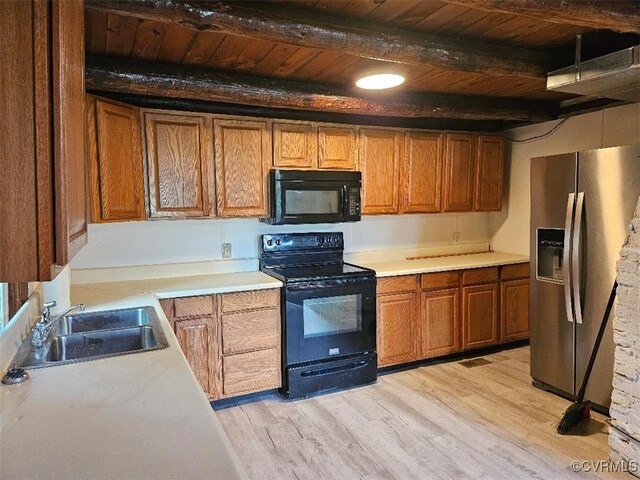25122 S Tidewater Trl, Tappahannock, VA 22560 - kitchen featuring black appliances, a wooden ceiling with exposed beams, light wood-style floors, light countertops, and brown cabinets