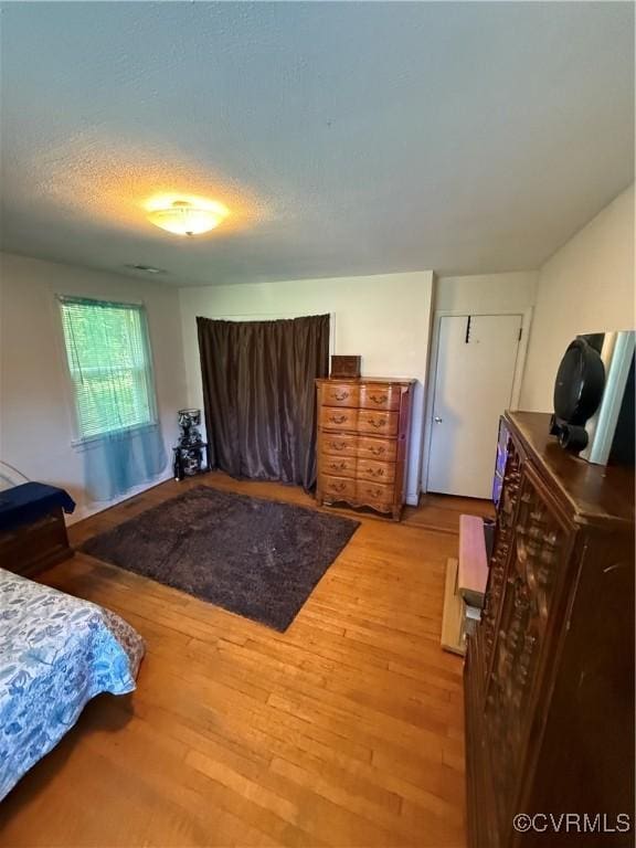 305 Danray Dr, Henrico, VA 23227 - bedroom featuring wood finished floors and a textured ceiling