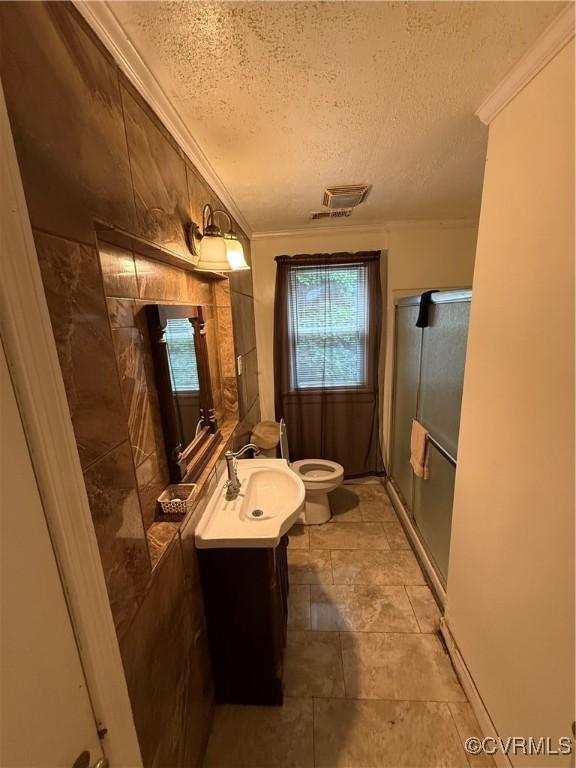 305 Danray Dr, Henrico, VA 23227 - bathroom featuring crown molding, a textured ceiling, vanity, and a shower stall