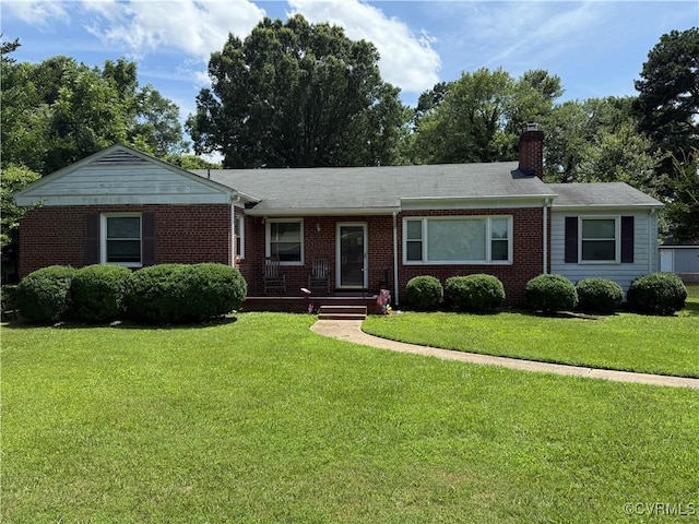 305 Danray Dr, Henrico, VA 23227 - single story home featuring brick siding, a front yard, a chimney, and a shingled roof