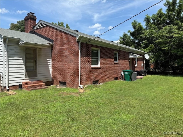 305 Danray Dr, Henrico, VA 23227 - view of side of property featuring a yard, entry steps, a chimney, and brick siding