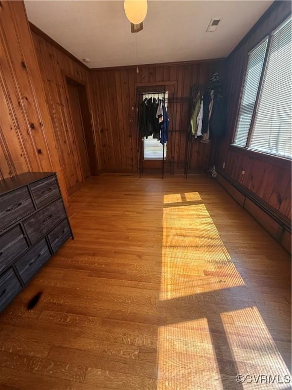 305 Danray Dr, Henrico, VA 23227 - spare room with light wood finished floors, baseboard heating, and wooden walls