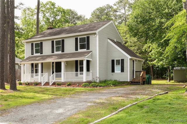 10002 Laurel Lakes Dr, Glen Allen, VA 23060 - view of front of home featuring a chimney, a porch, and a front yard