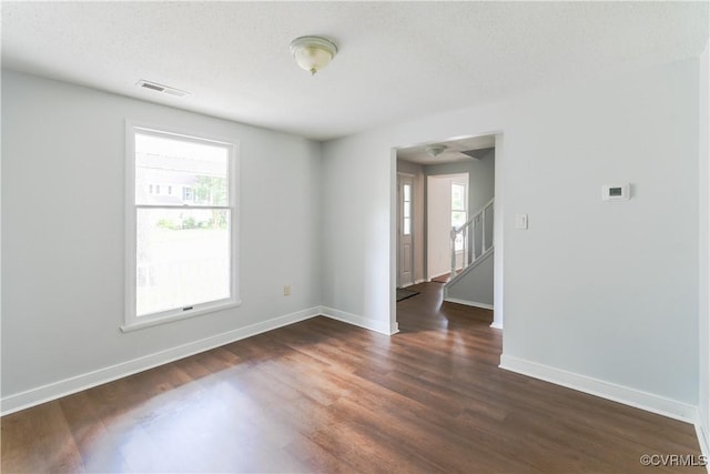 10002 Laurel Lakes Dr, Glen Allen, VA 23060 - spare room featuring dark wood-style flooring and stairway