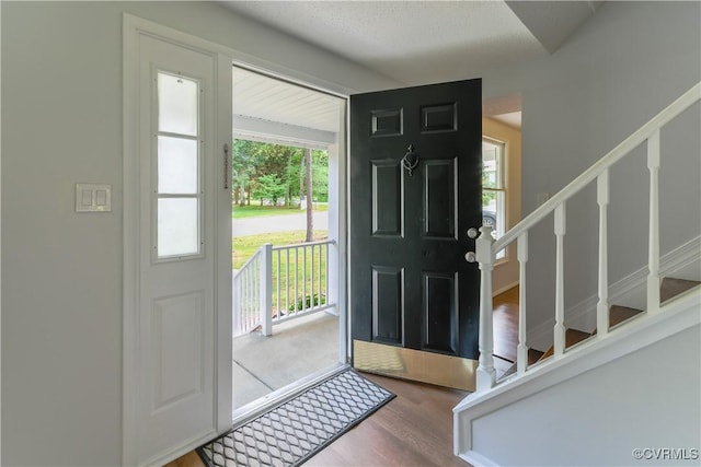 10002 Laurel Lakes Dr, Glen Allen, VA 23060 - foyer with stairs and wood finished floors