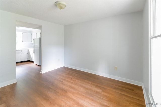 10002 Laurel Lakes Dr, Glen Allen, VA 23060 - empty room with dark wood finished floors and baseboards