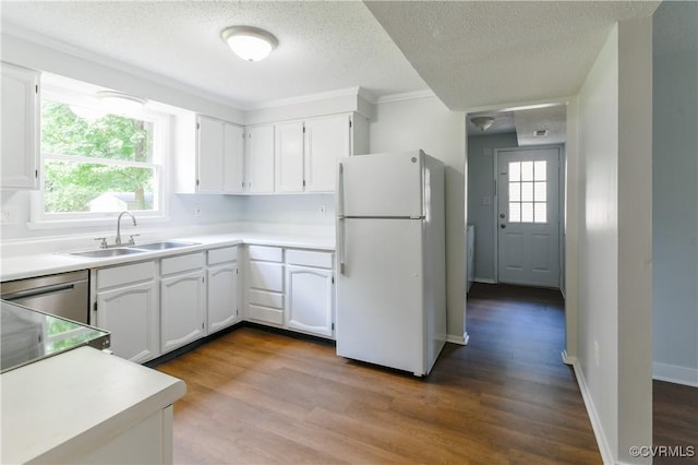 10002 Laurel Lakes Dr, Glen Allen, VA 23060 - kitchen with freestanding refrigerator, a textured ceiling, white cabinets, wood finished floors, and light countertops
