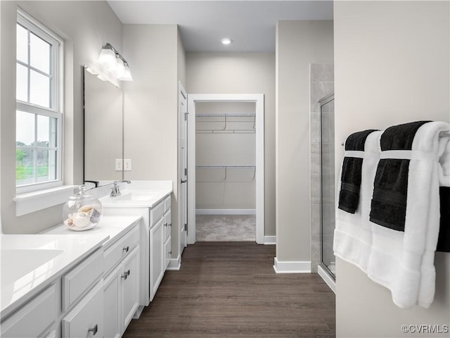 0 Crosswinds Dr, North Chesterfield, VA 23234 - bathroom featuring a stall shower, vanity, wood finished floors, a walk in closet, and recessed lighting